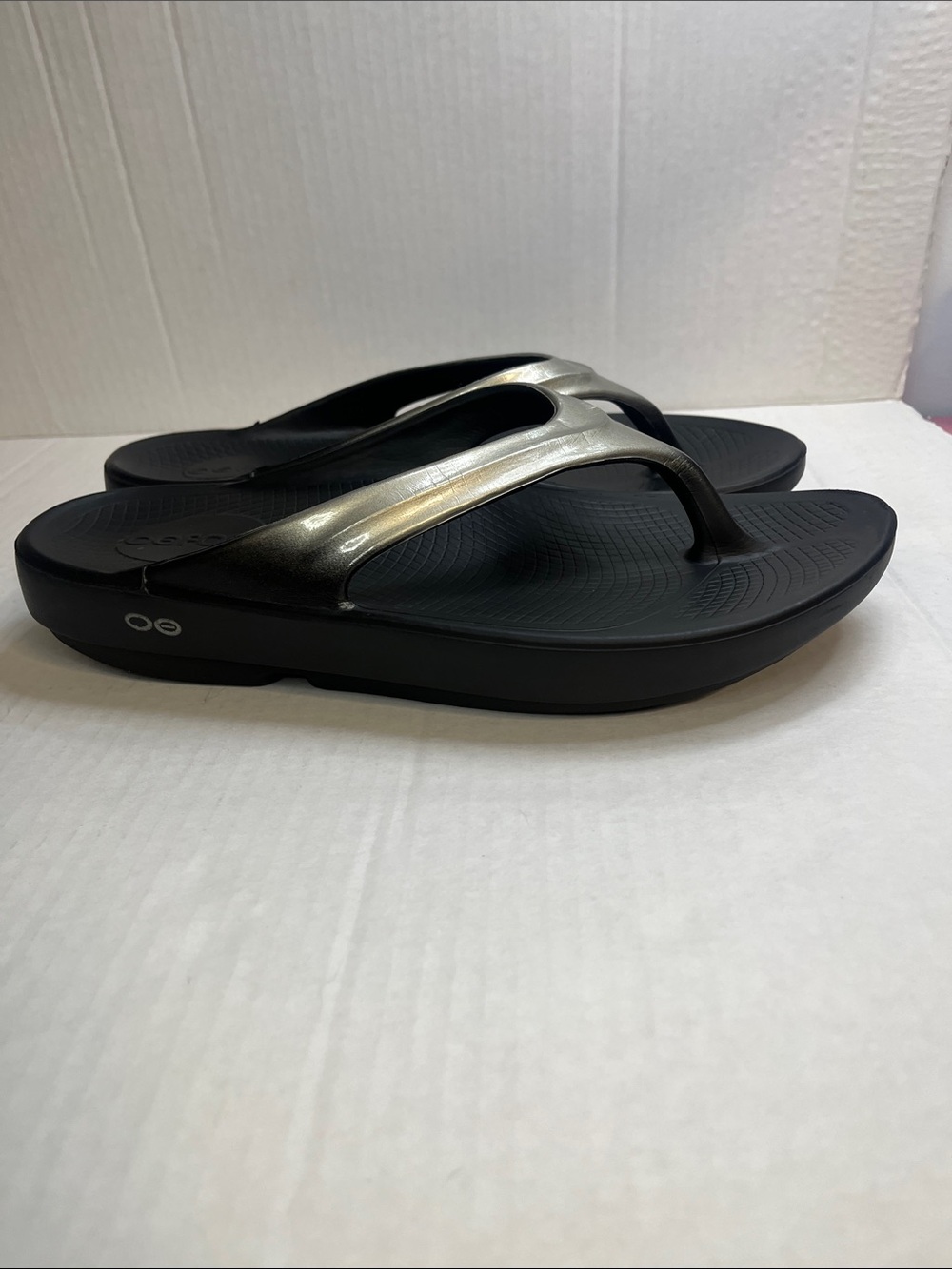OOFOS Women's Black Flip Flop Sandals with Metallic Silver Straps - Picture 6 of 12